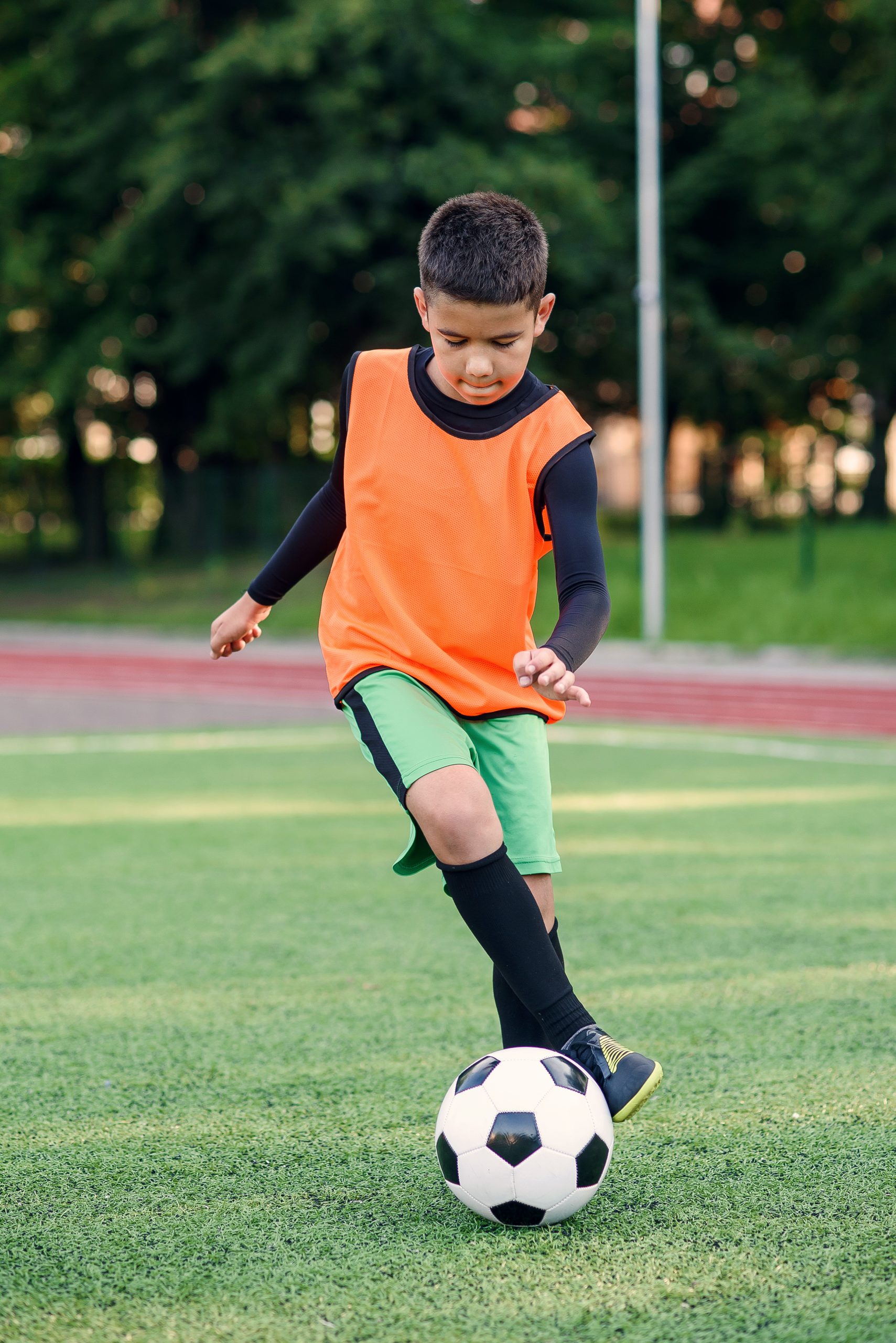 soccer-player-training-with-ball-scaled-1